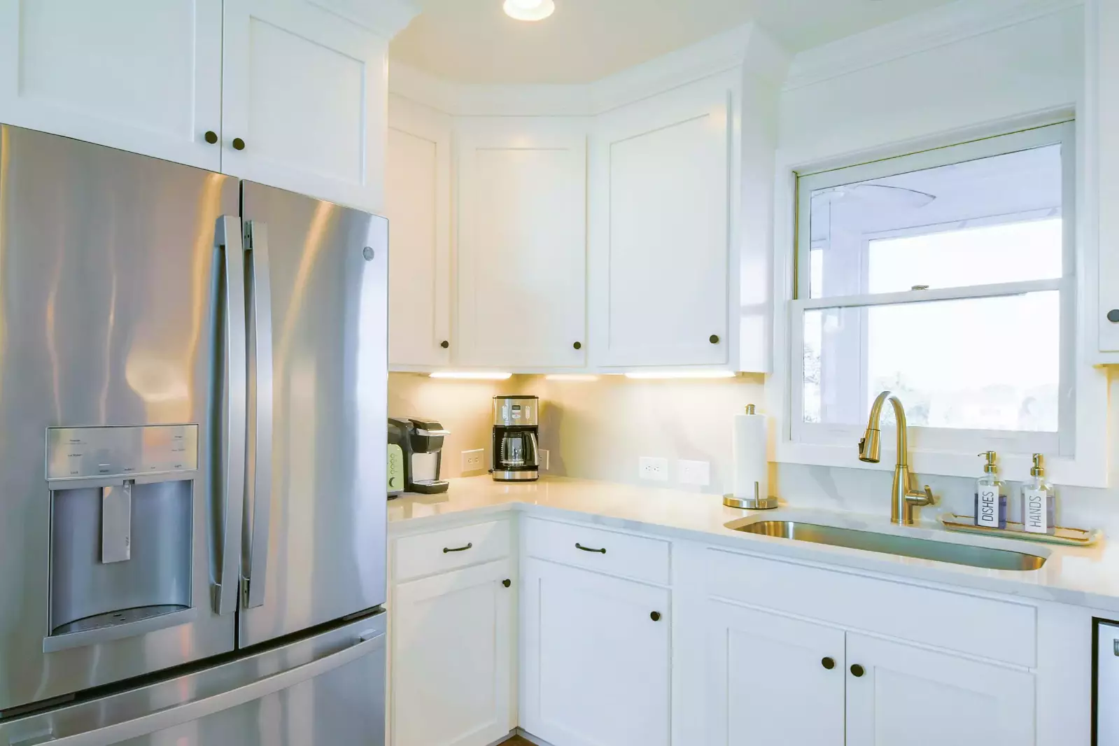 The kitchen also has a dishwasher, refrigerator, garbage disposal, Keurig and drip coffee maker.