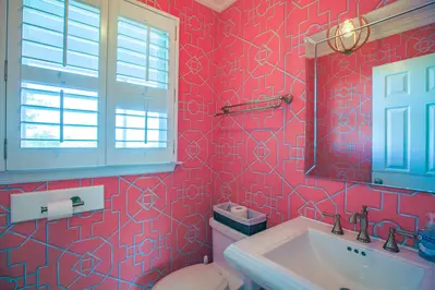 This half bathroom is located on the home's third floor between the kitchen and living room.