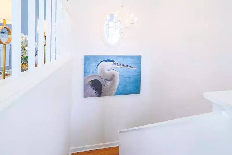 This stairway connects the living room, kitchen & dining room to the lower level bedrooms.