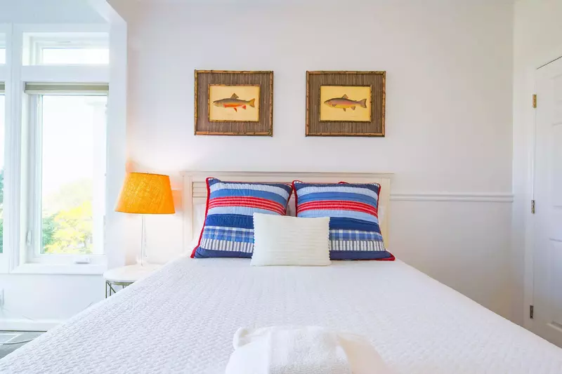 This guest bedroom is also located on the home's second floor.