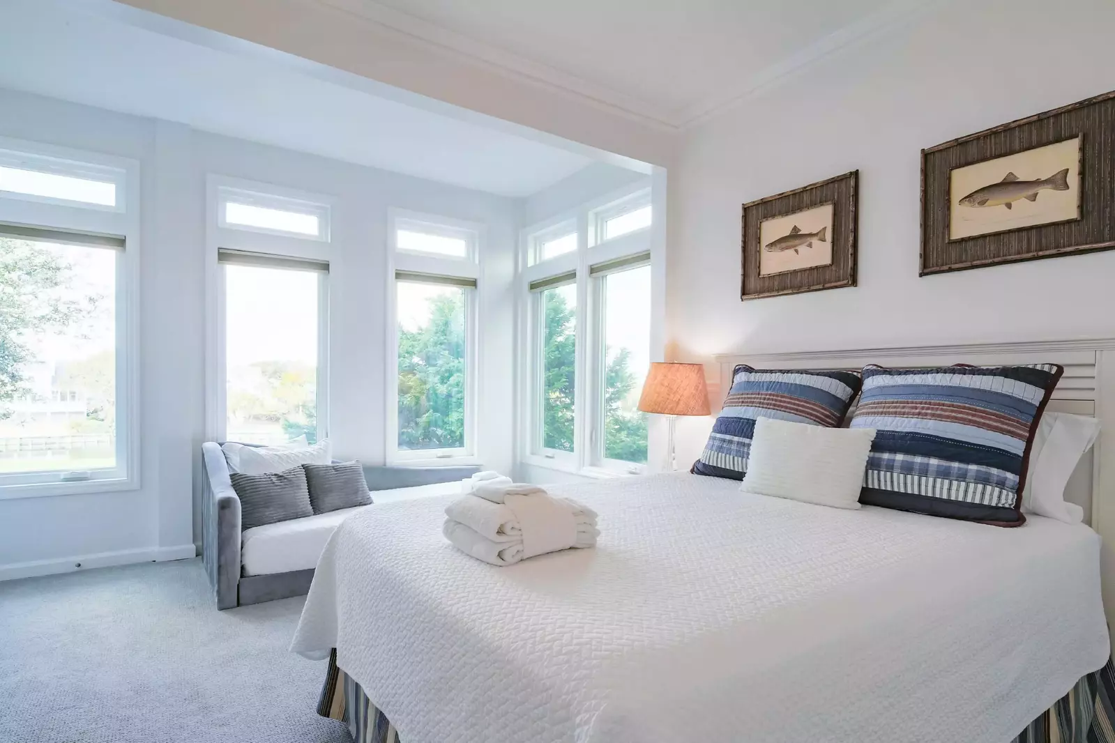This bedroom enjoys terrific natural light and overlooks the lagoon behind the home.