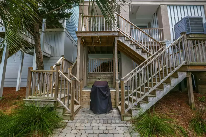 There is a propane grill at the base of the exterior stairs.