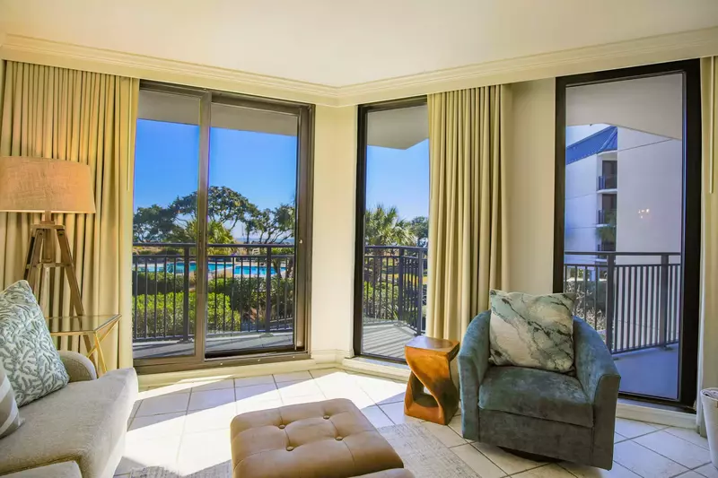 The condo's private balcony extends around the living room and master bedroom.