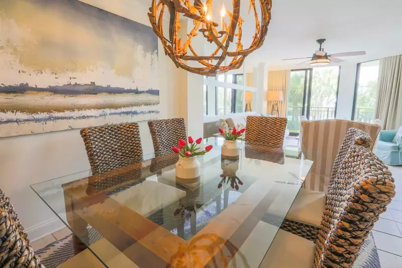 The dining table comfortably seats 6 people.  There are also 2 stools alongside the kitchen counter.