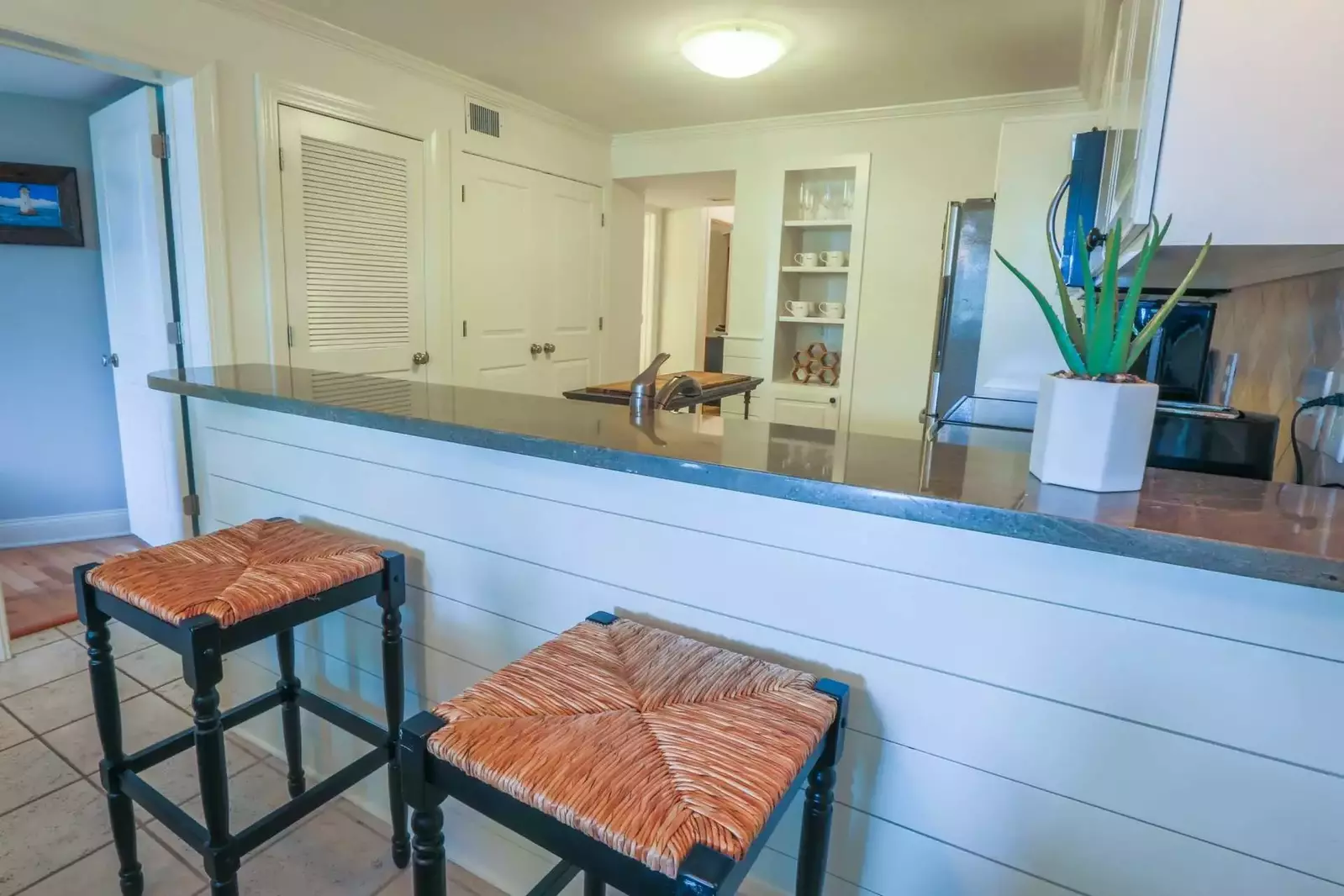 The doorway on the left side of this photo leads to the master suite.