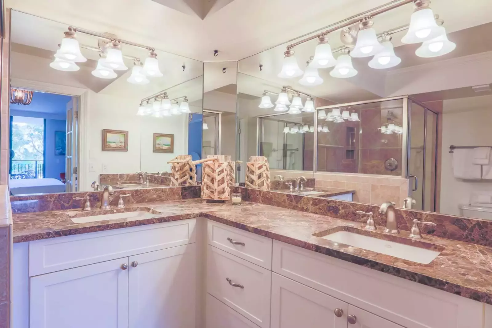 The renovated master bath features plenty of countertop and cabinet space to store your personal belongings.