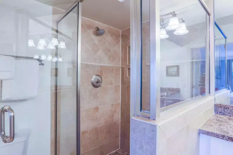 The master en suite bathroom also has a tiled, walk-in shower.