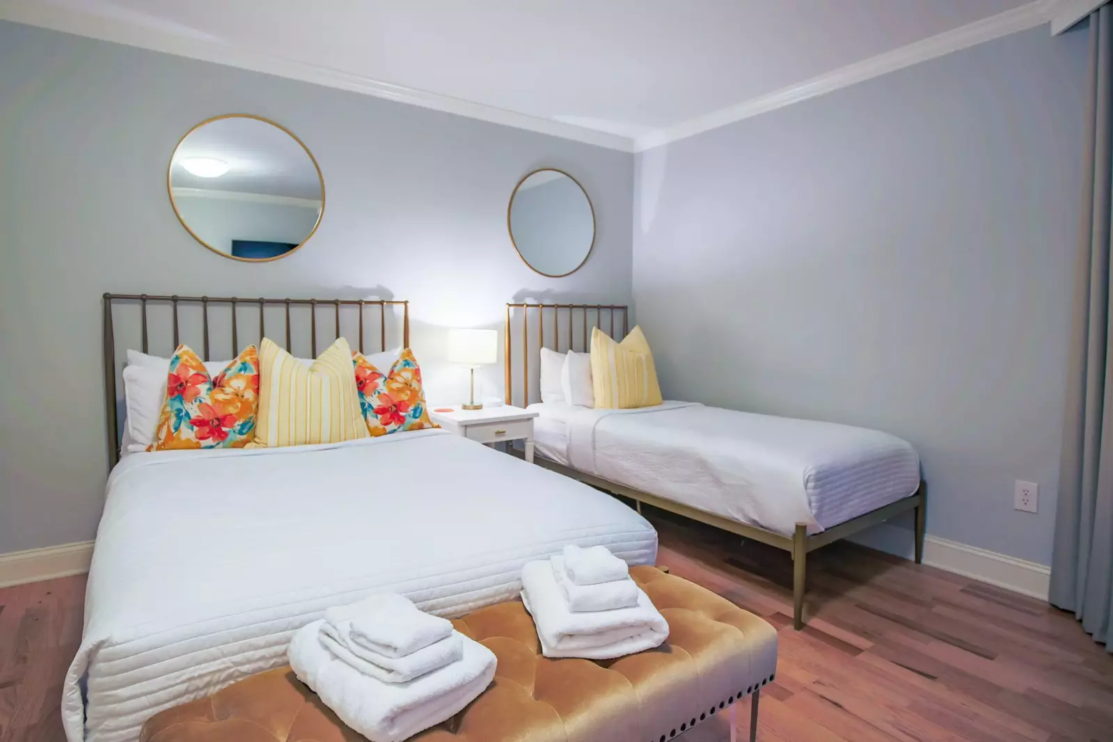 The guest bedroom features a full bed and a twin bed.