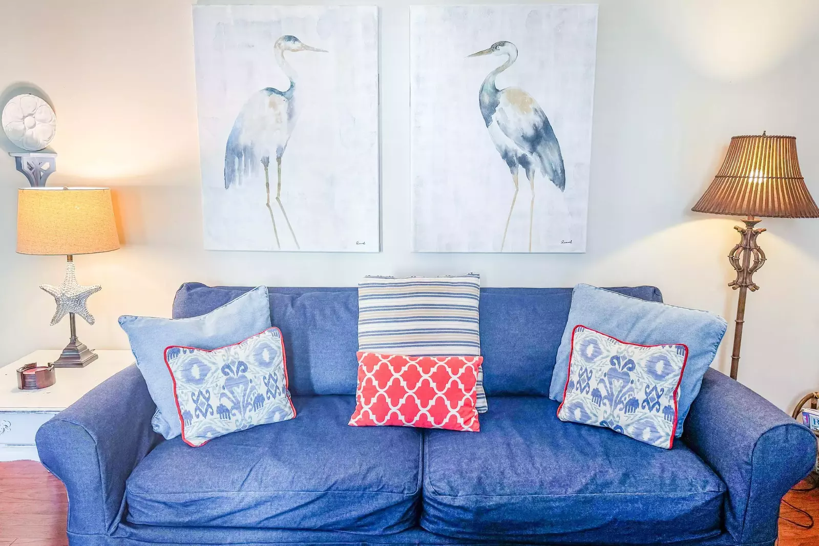 When you step inside the front door, you'll enter the home's comfortable living room complete with two herons.