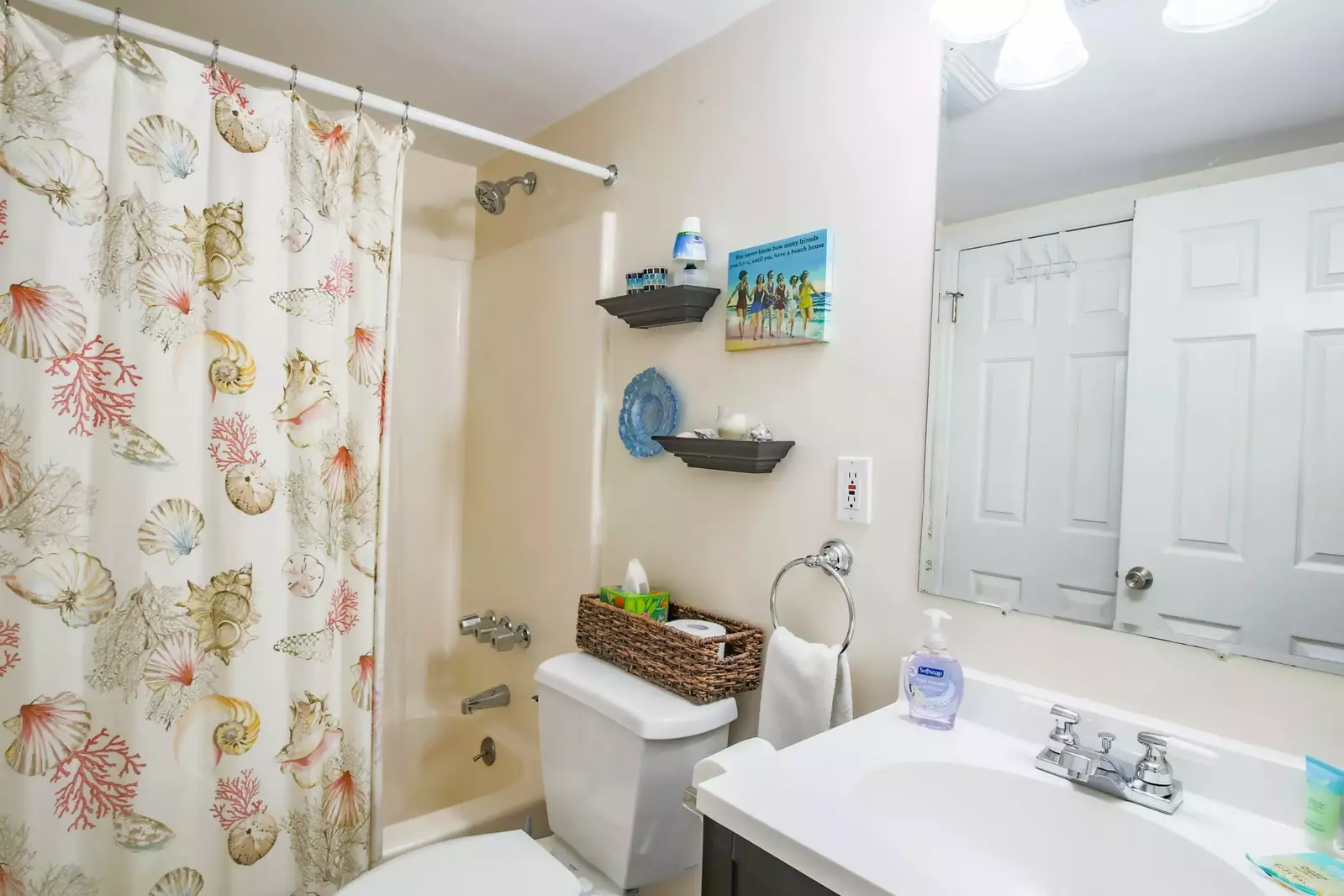 This ground floor bathroom features a shower/tub combo and spacious vanity.