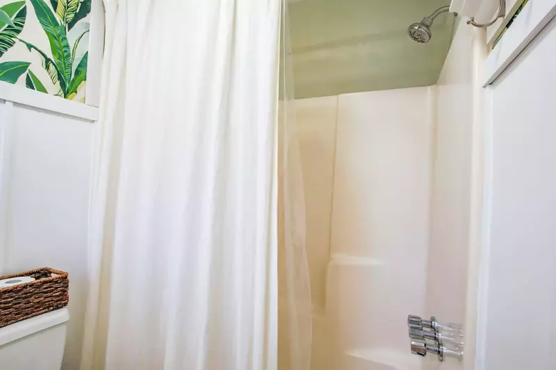 The master bathroom also has a shower/tub combo.