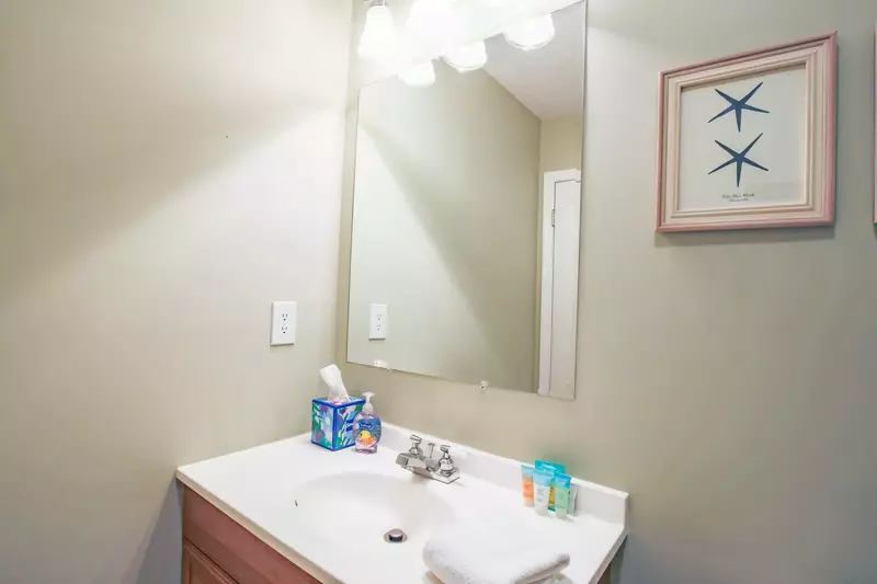 This en suite bathroom features a spacious vanity.