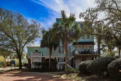 Coastal Chic is a three story detached townhome within the Grand Pavilion community.