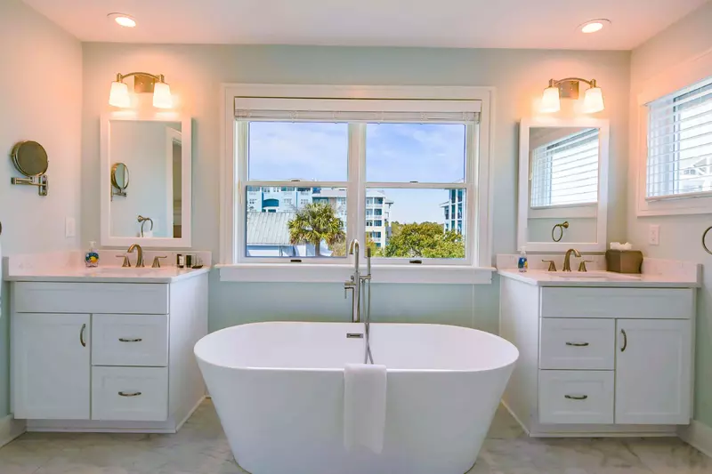The newly renovated en suite bathroom has a soaking tub and his & her vanities & sinks.