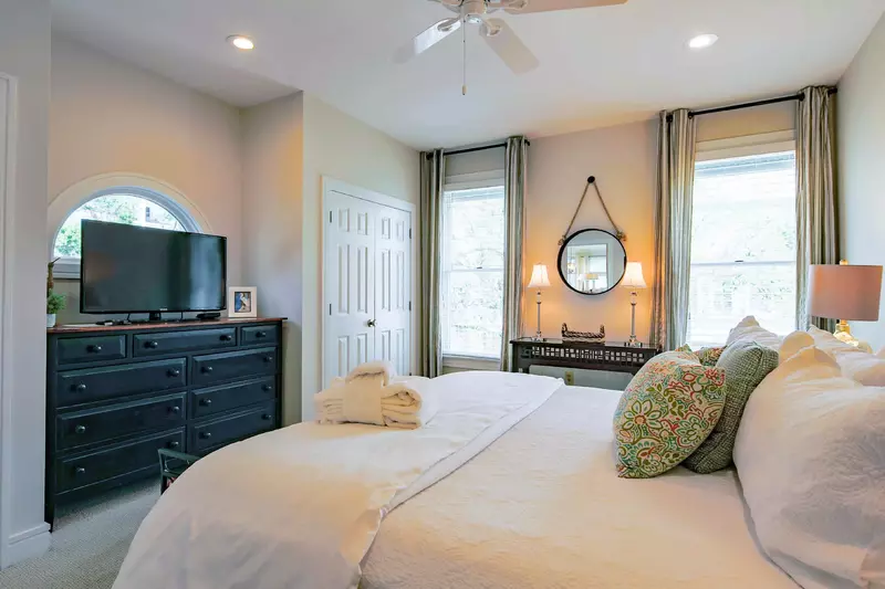 The ground floor master suite also has carpeted floors, a dresser and a large screen cable TV.