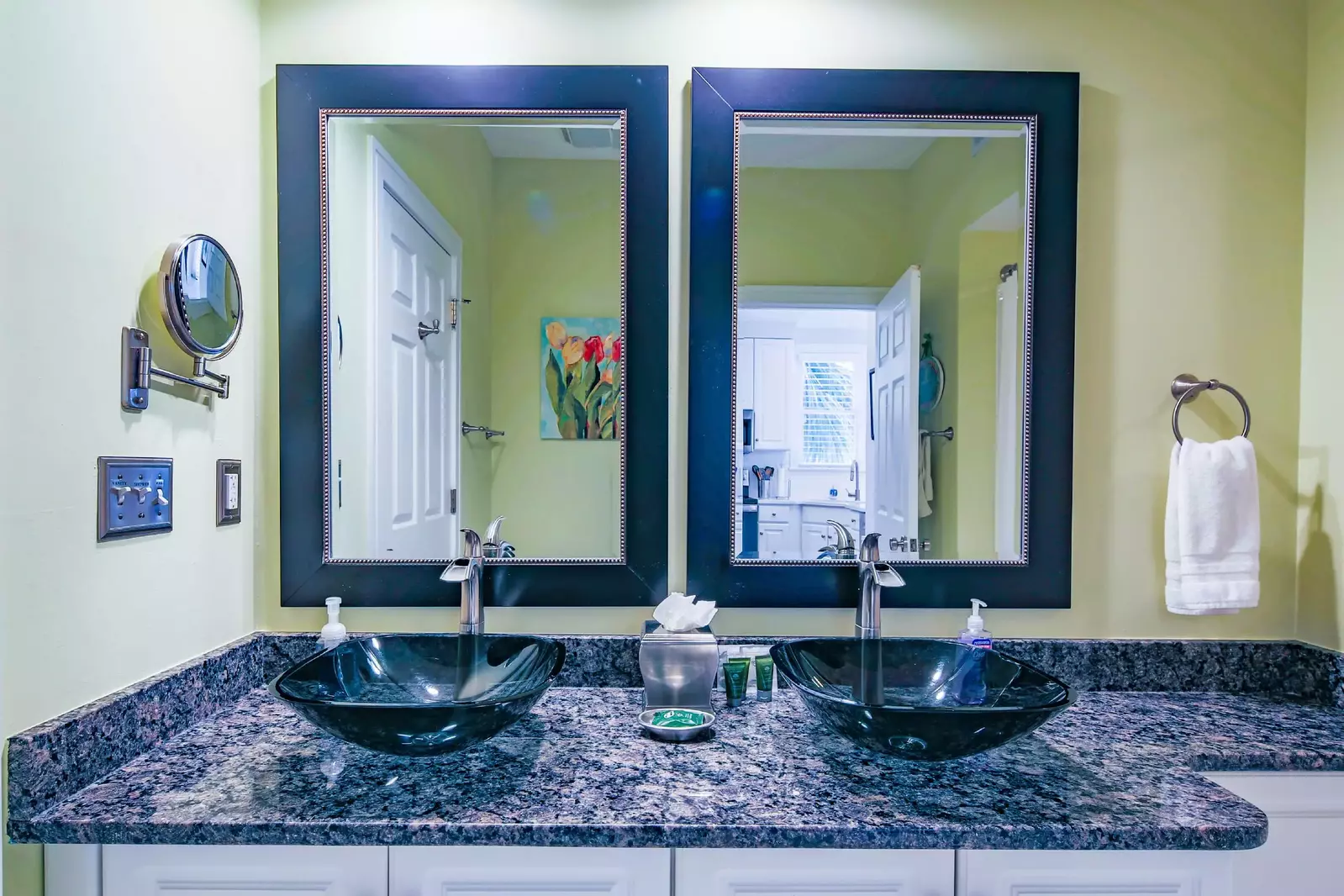 This bathroom has a large vanity with his & her sinks and plenty of storage area for your personal items.