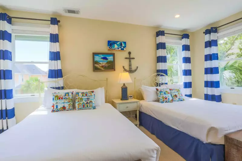 Guests in this queen suite will hear the soothing sounds of rustling palms that are located just off the home.