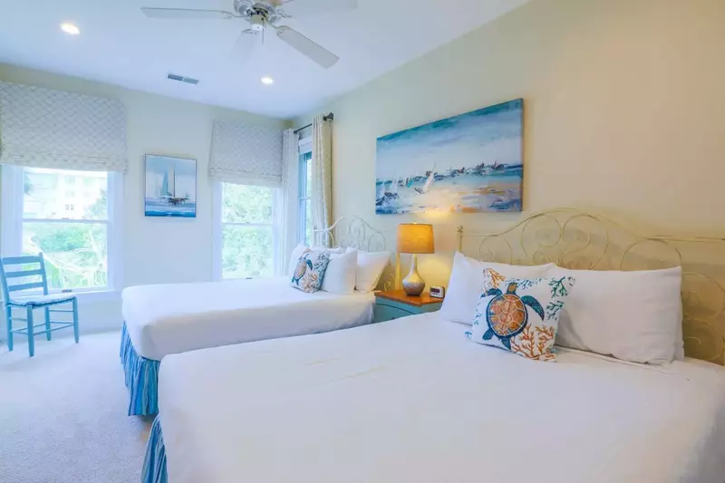 The second queen suite on the second floor also features two queen beds.