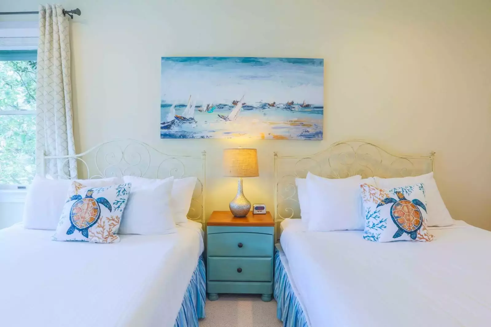 The blues, teals and orange colors in this room remind you that you are only a quick walk away from the beach.