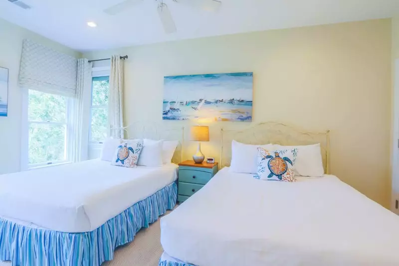 Guests of this room will enjoy looking out into the live oak tree that sits alongside the front of the home.