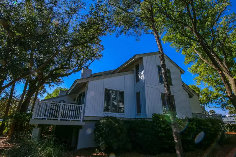 The Charburgh Yacht Club is located on an end unit with an abundance of windows.