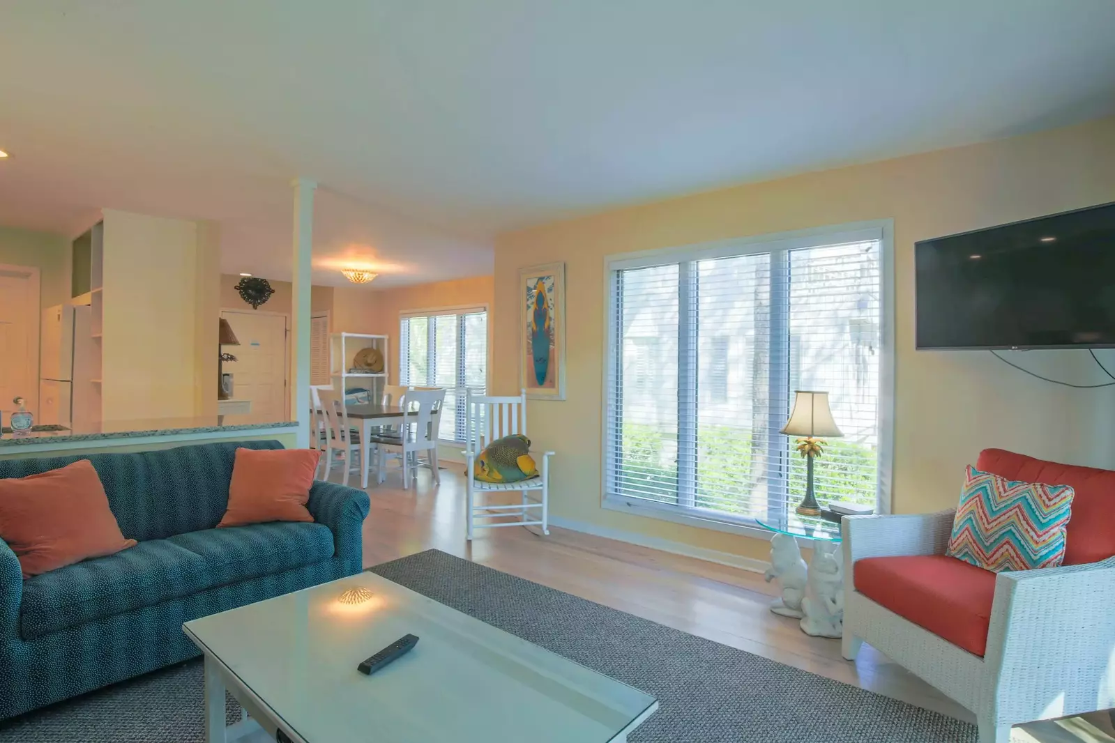 The dining area flows into the home's kitchen and living room.