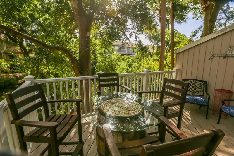 There's an outdoor dining table and a separate seating area on this private balcony.