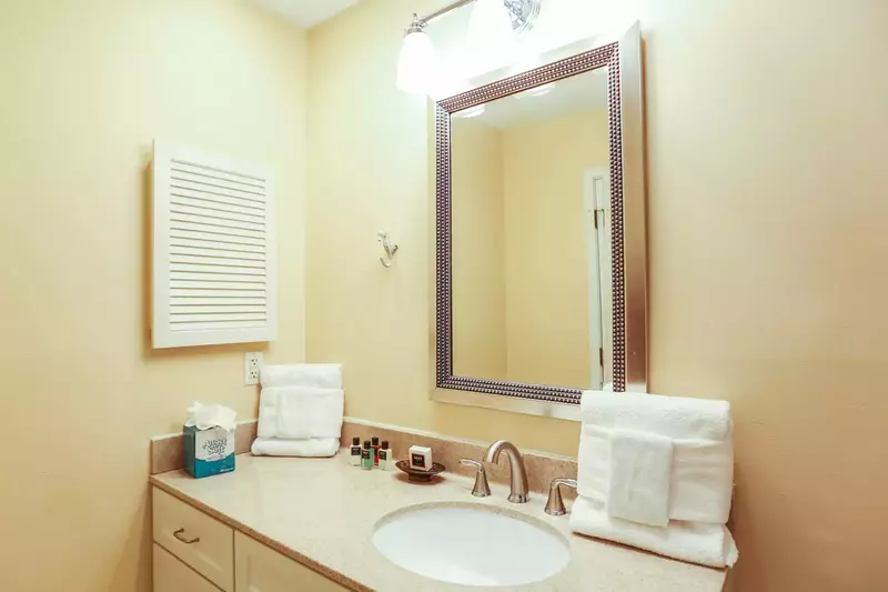 The master bedroom has an en suite bathroom with a spacious vanity.