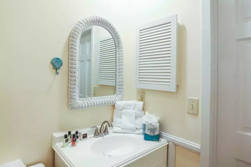 This bathroom is located beside the guest bedroom.