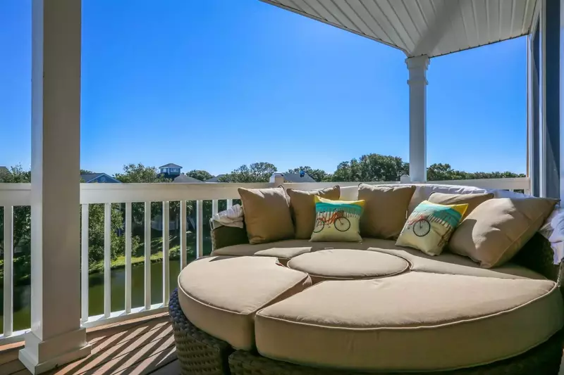 Listen to the sounds of chirping birds, cicadas and ocean breezes from this fantastic second floor screened porch.