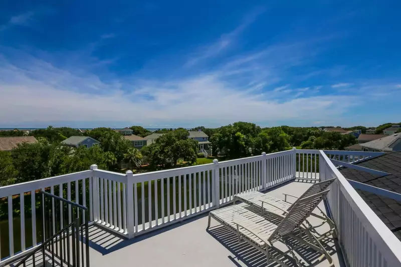 You take the spiral staircase from the second-level deck to reach this glorious roof deck.