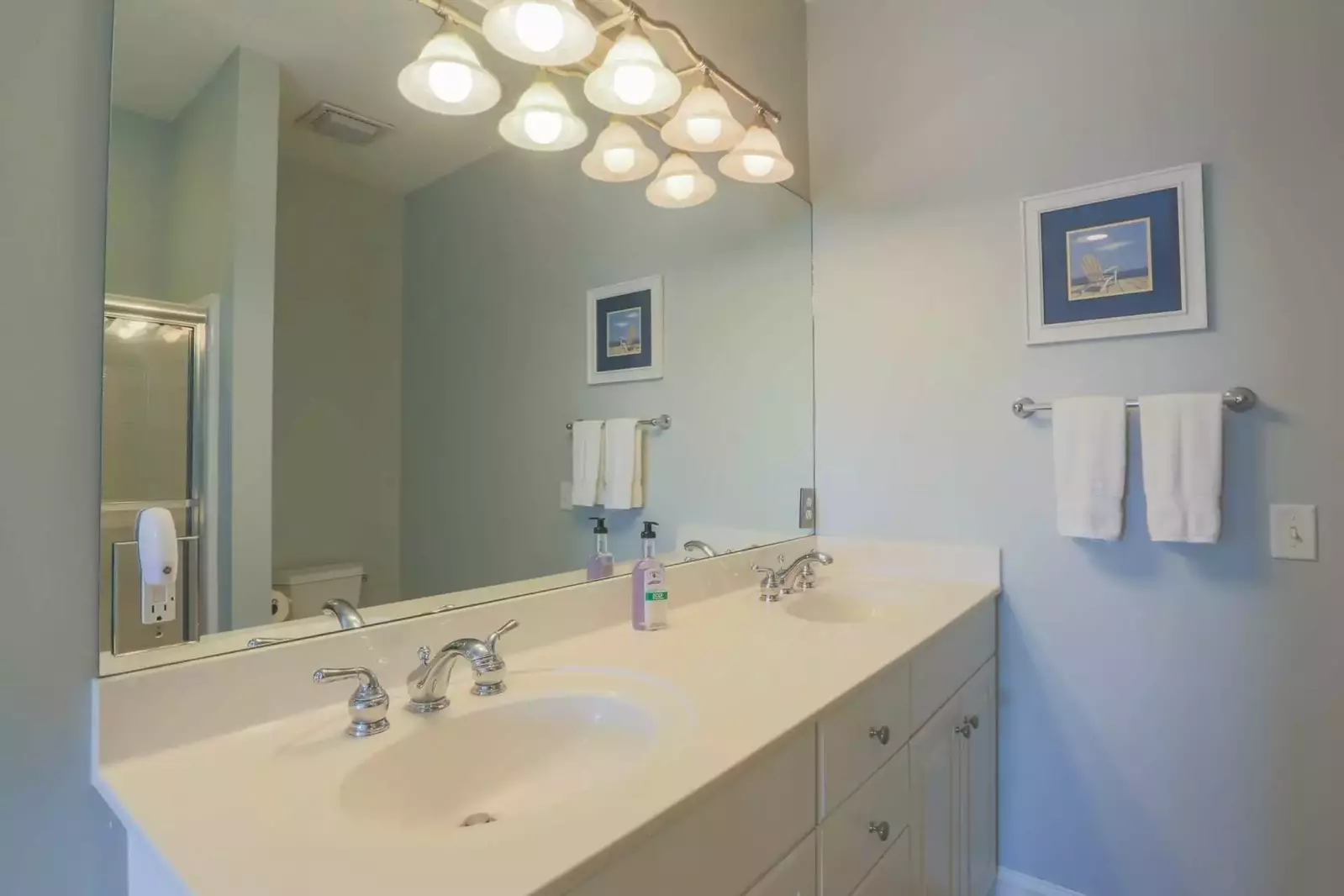The master bedroom has an en suite bathroom with a spacious, double sink vanity.