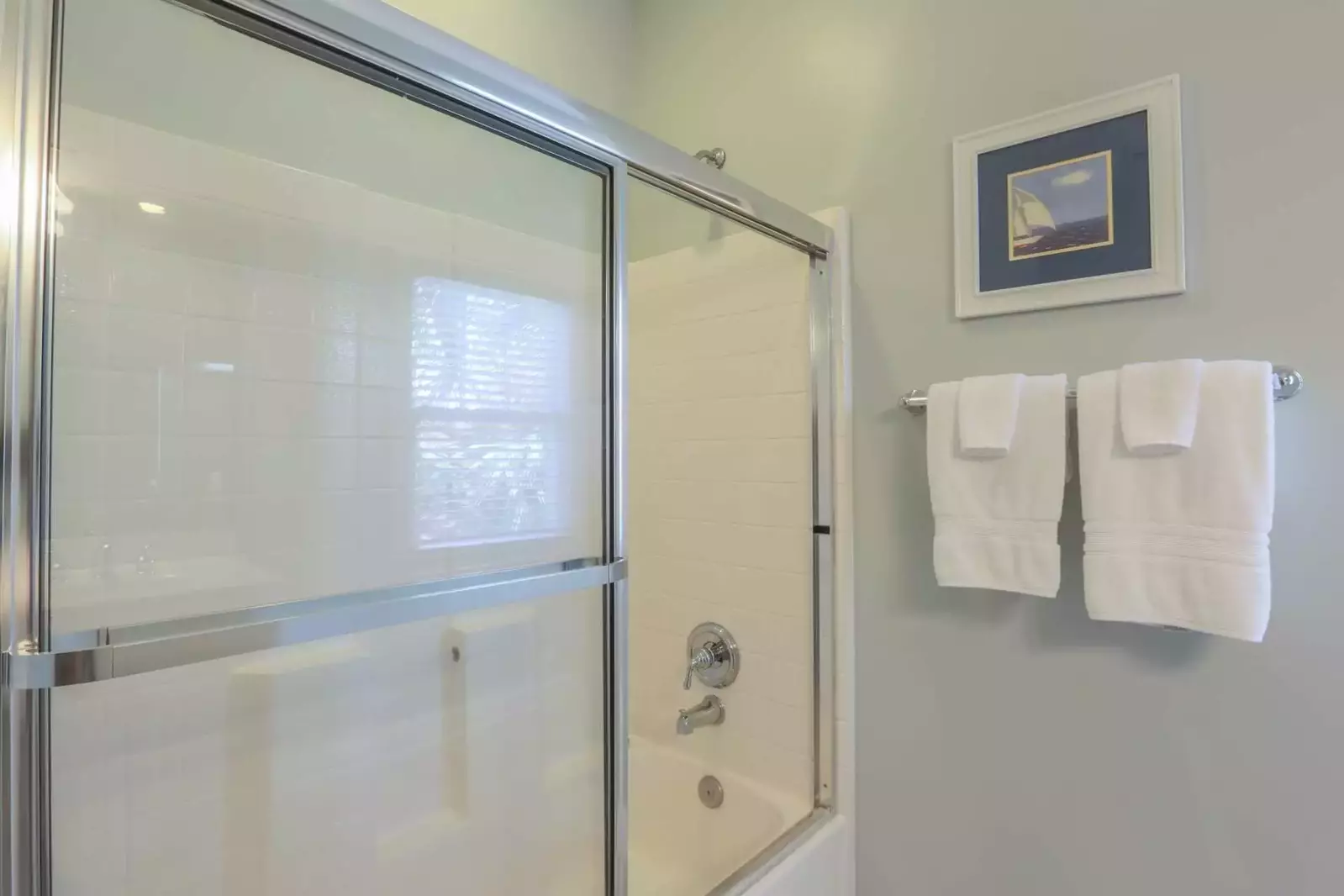 The en suite bathroom for the master suite also has a tiled shower & tub.