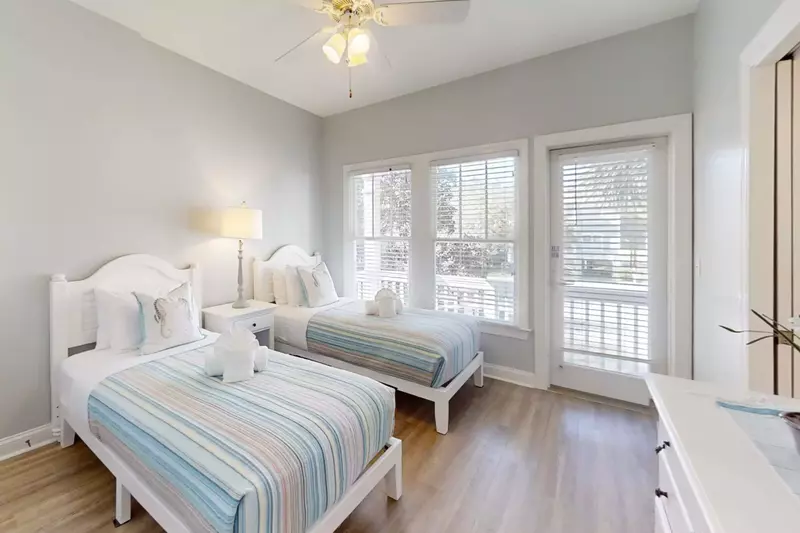 This bedroom accesses the narrow deck on the front of the home and has an en suite bathroom.