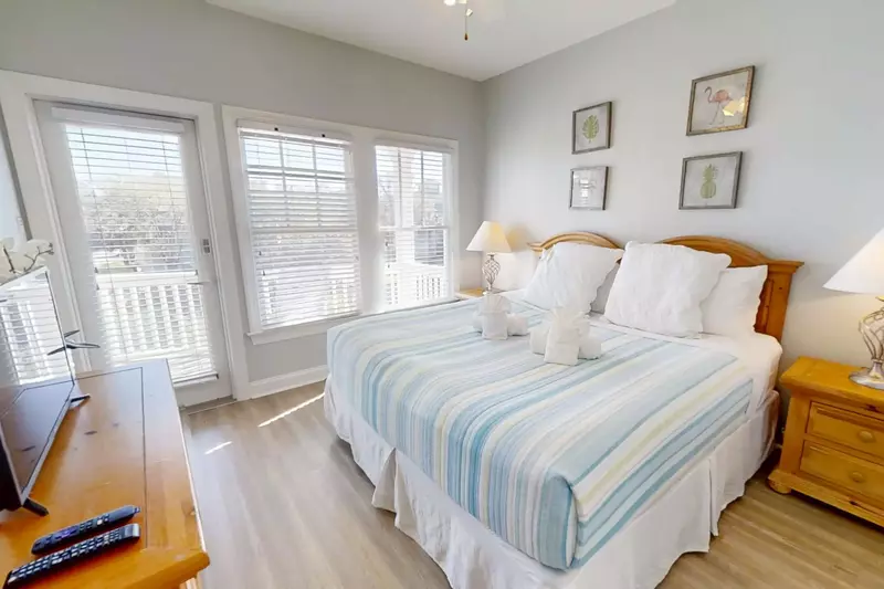 This guest suite features a king bed and night stands with reading lamps.
