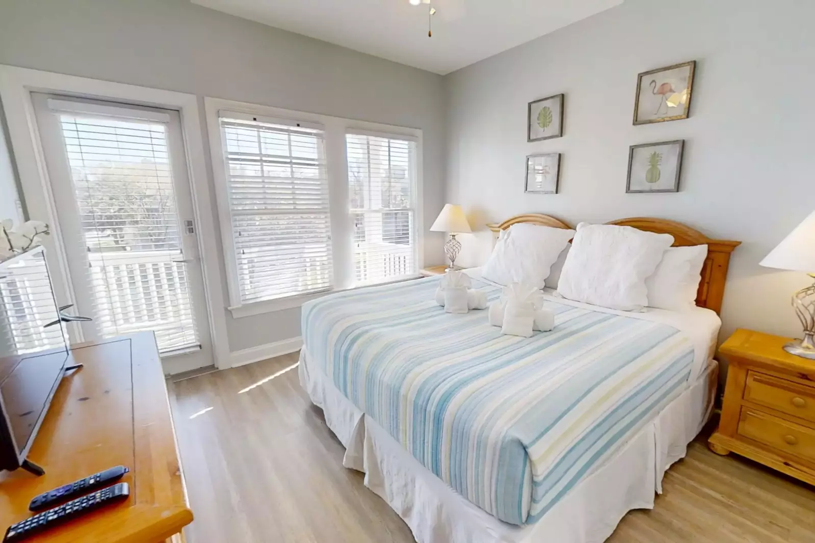 This guest suite features a king bed and night stands with reading lamps.