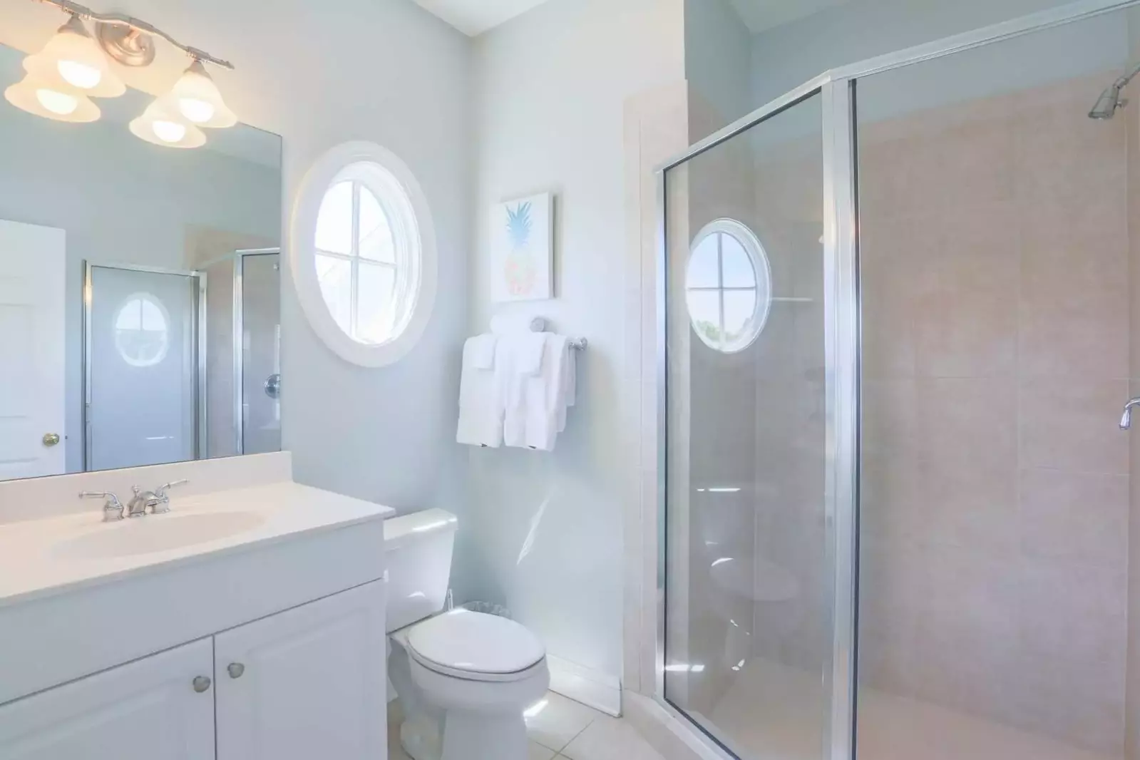 The en suite bathroom features a tiled, walk-in shower and vanity.