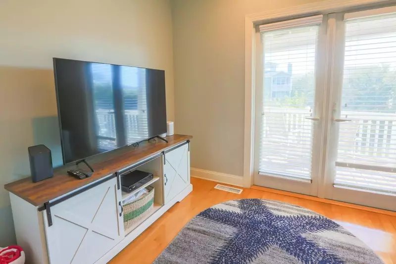 The den also has a large screen cable TV.