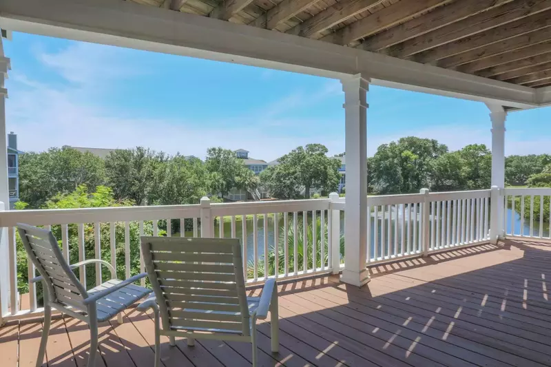 This covered deck on the first level of the home is a great place to watch for wildlife in and around the lagoon.