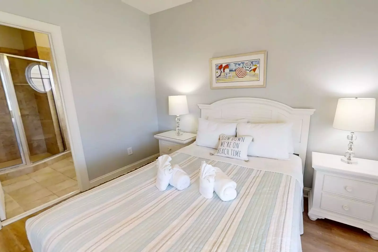 The en suite bathroom for the queen suite is located through the door on the left in this photo.