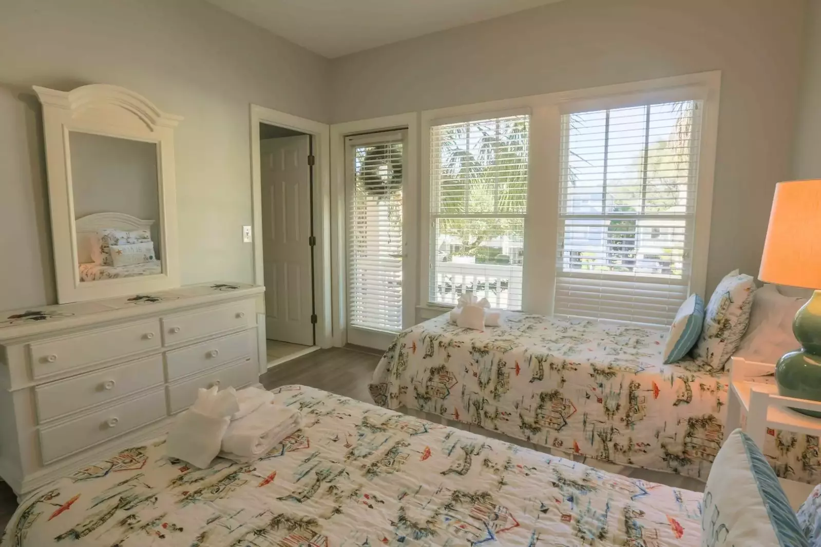 The doorway on the left leads to the en suite bathroom and the doorway on the right leads to the front porch.