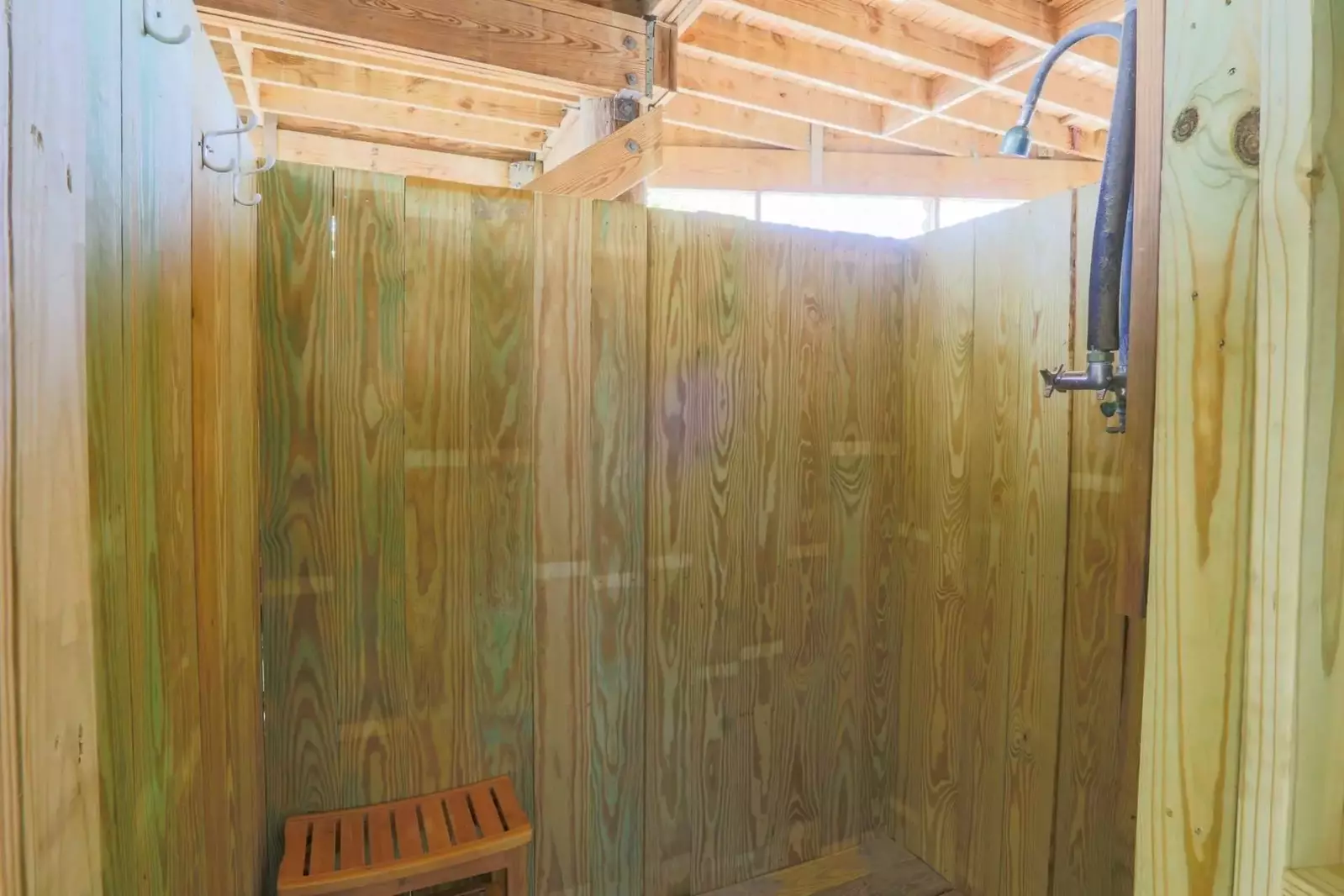 There is also a private outdoor shower in the carport area beneath the house.