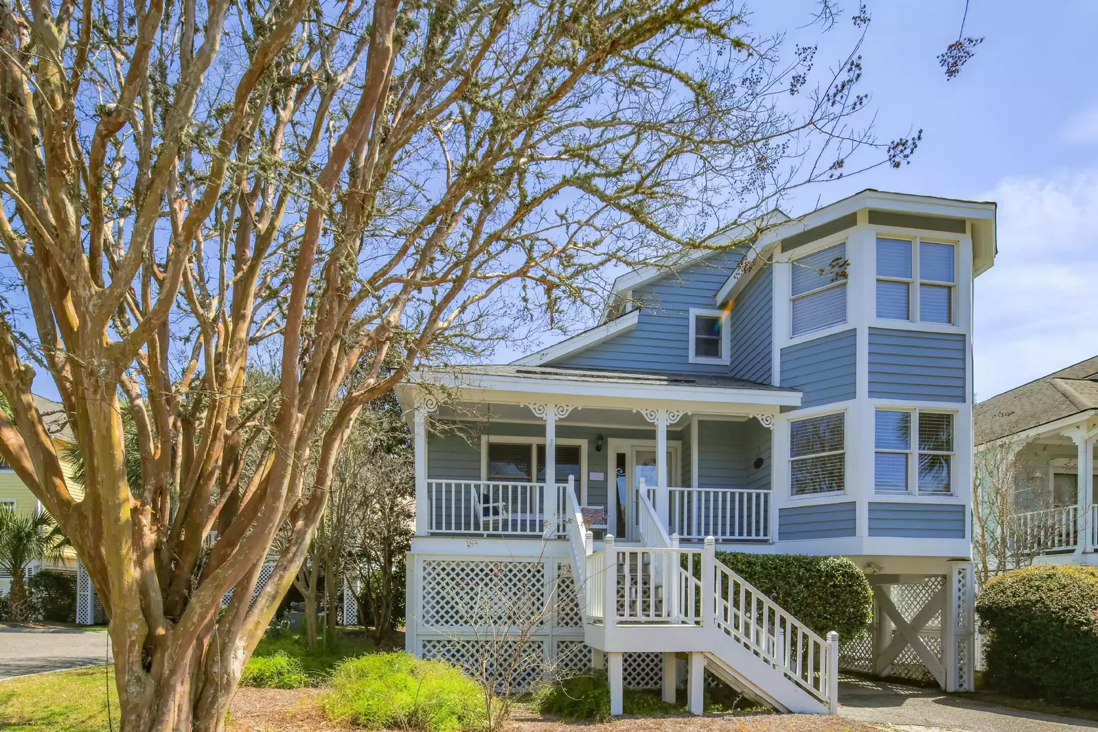 The Coastal Cottage is an elevated home with a carport area beneath the house.