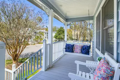 The swing and outdoor chair welcome you when you step onto the front porch.