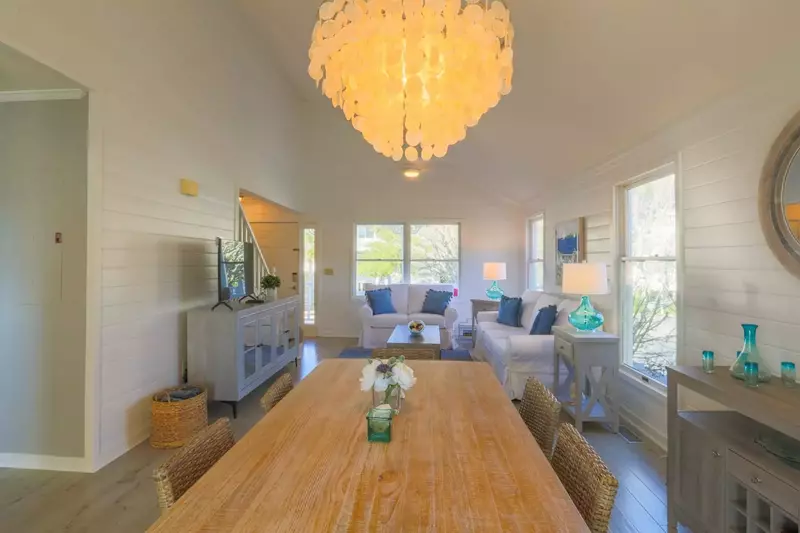 The cottage has an open floor plan layout between the living room and dining room.
