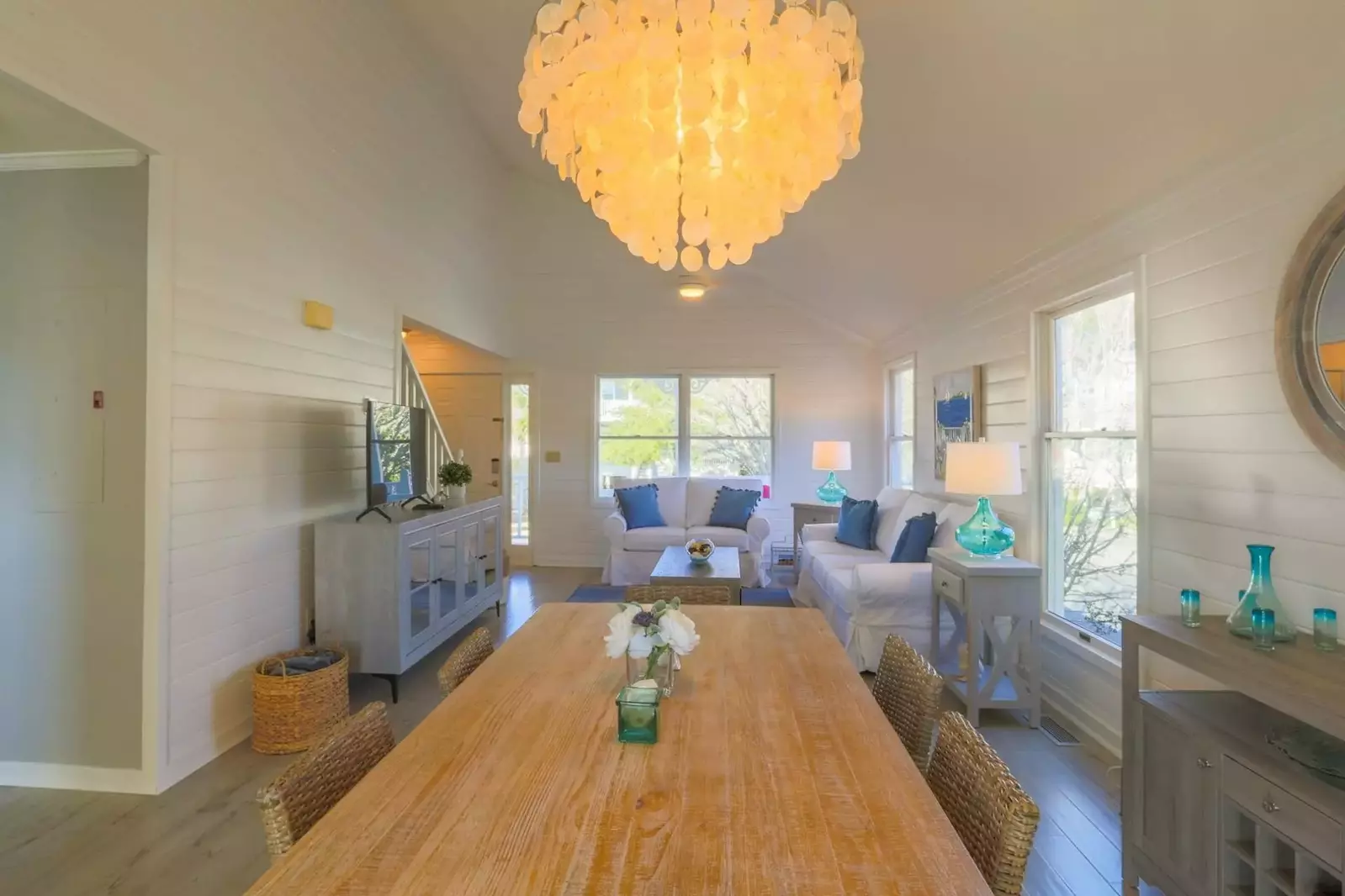 The cottage has an open floor plan layout between the living room and dining room.