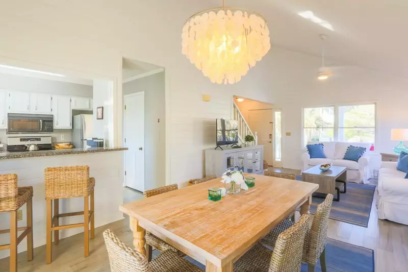 The indoor dining table comfortably seats 6 people.  There are also 2 stools alongside the kitchen counter.