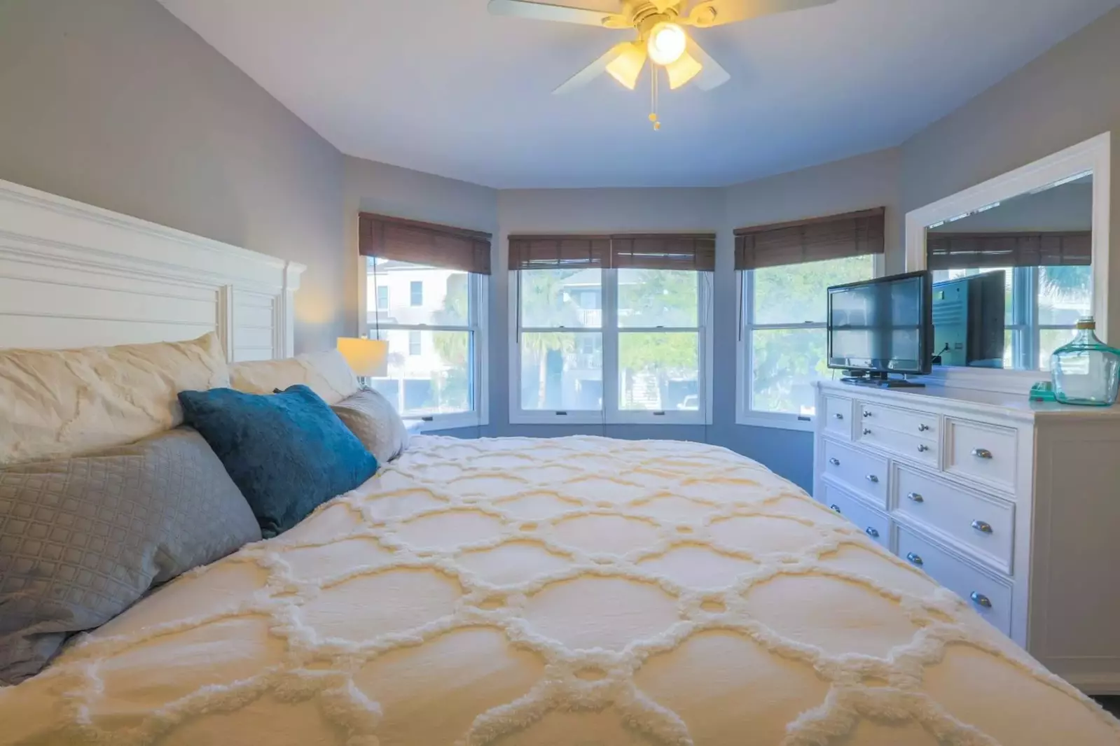 The master bedroom suite features a king bed and dresser with cable TV.