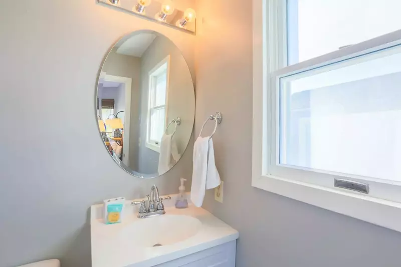 This en suite bathroom features a new vanity and a walk-in shower.