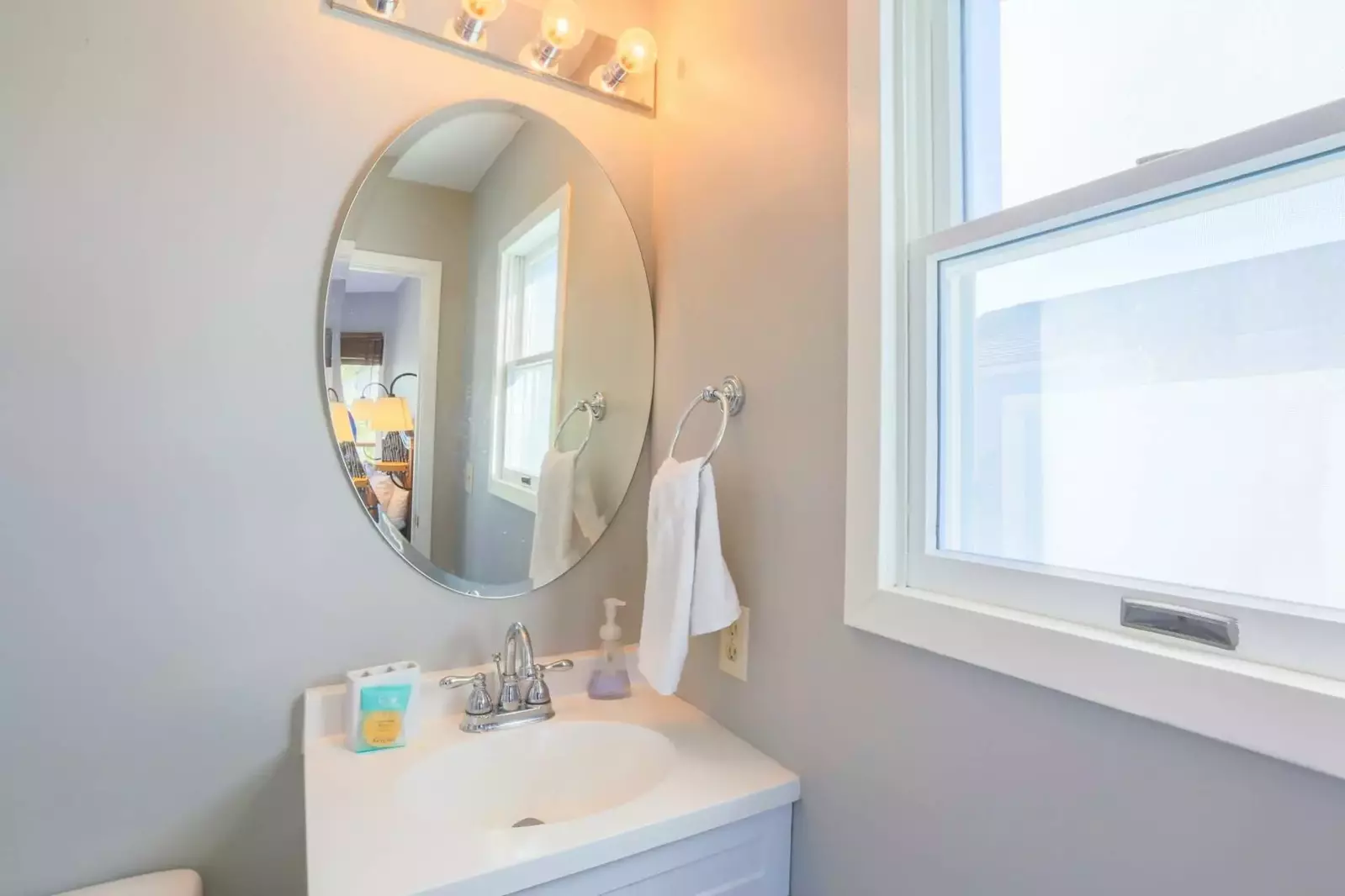This en suite bathroom features a new vanity and a walk-in shower.